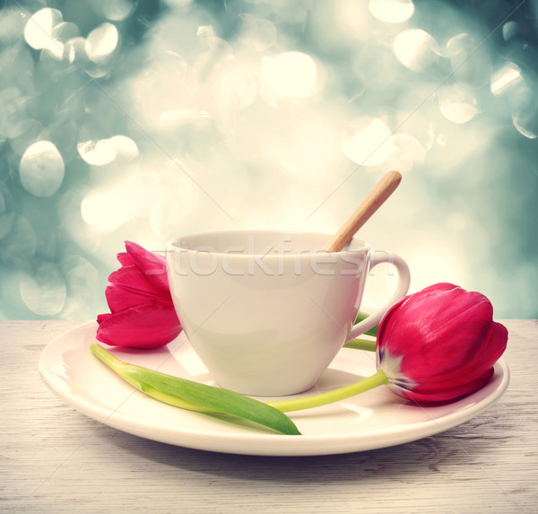 Coffee cup with red tulips Stock photo © Melpomene