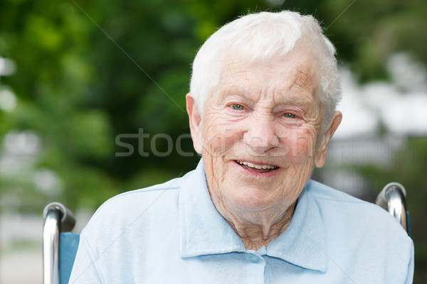 Boldog idős hölgy tolószék mosolyog kívül Stock fotó © Melpomene