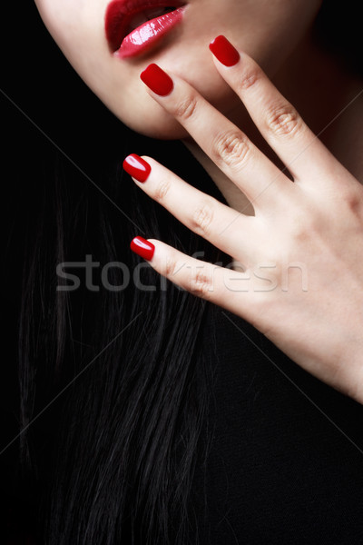 Uñas de color rojo labios largo pelo negro moda Foto stock © Melpomene
