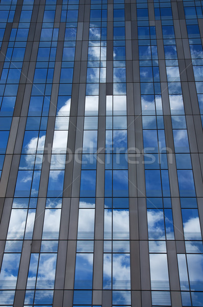 Felhőkarcoló modern égbolt fehér felhők tükröződések Stock fotó © MichaelVorobiev