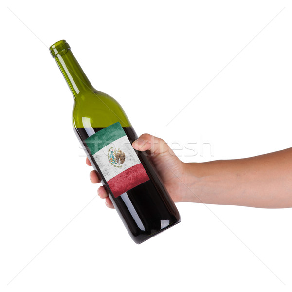 Mano bottiglia vino rosso etichetta Messico Foto d'archivio © michaklootwijk
