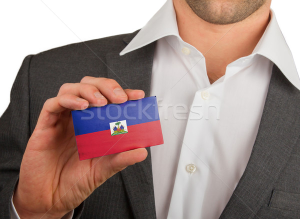 Businessman is holding a business card, Haiti Stock photo © michaklootwijk