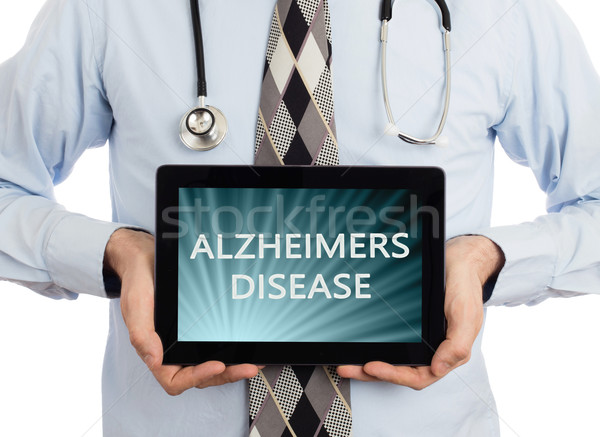 Doctor holding tablet - Alzheimers disease Stock photo © michaklootwijk