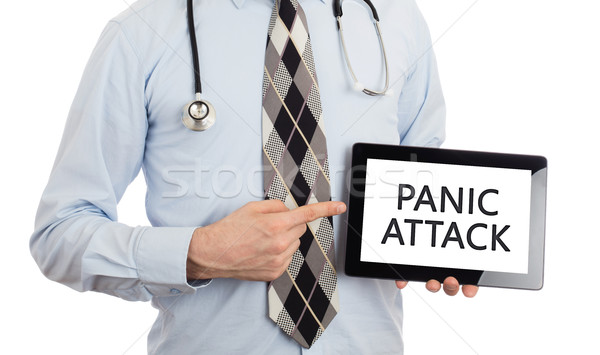 Doctor holding tablet - Panic attack Stock photo © michaklootwijk