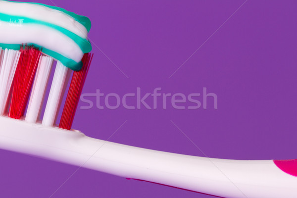 A pink toothbrush with toothpaste Stock photo © michaklootwijk