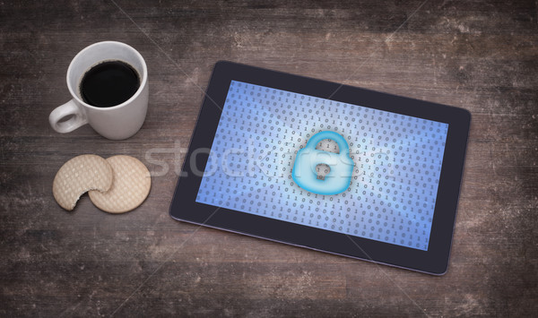 Tablet on a desk, concept of data protection Stock photo © michaklootwijk