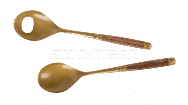 Old brass serving spoons isolated Stock photo © michaklootwijk