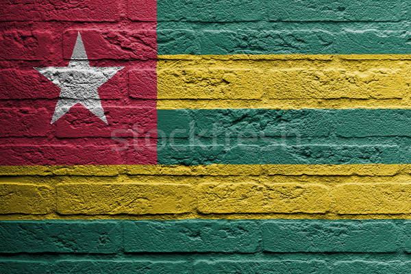 Murem malarstwo banderą Togo odizolowany ściany Zdjęcia stock © michaklootwijk