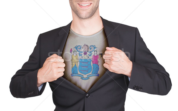 Businessman opening suit to reveal shirt with state flag Stock photo © michaklootwijk