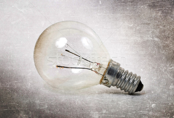Old lightbulb isolated on a white background Stock photo © michaklootwijk