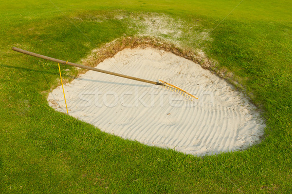 Golf: sand trap on the green grass Stock photo © michaklootwijk