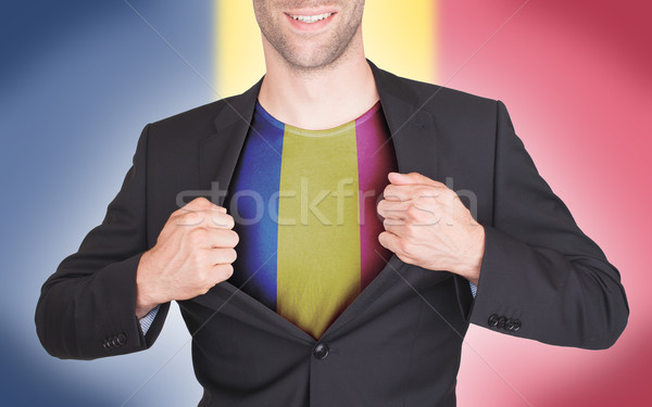 Businessman opening suit to reveal shirt with flag Stock photo © michaklootwijk