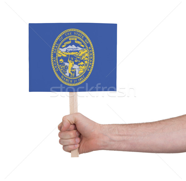 Hand holding small card - Flag of Nebraska Stock photo © michaklootwijk