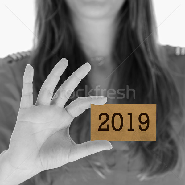 Woman showing a business card - 2019 Stock photo © michaklootwijk