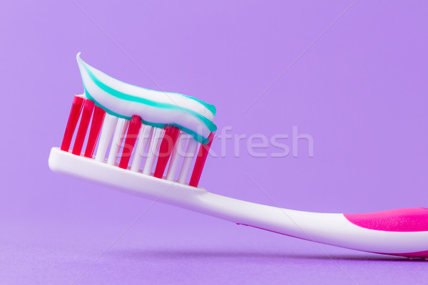 A pink toothbrush with toothpaste Stock photo © michaklootwijk