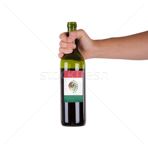 Foto stock: Mano · botella · vino · tinto · etiqueta · México