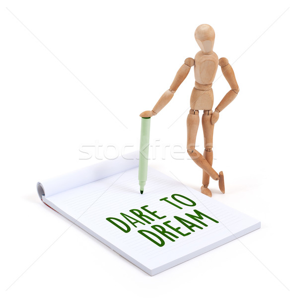 Wooden mannequin writing - Dare to dream Stock photo © michaklootwijk