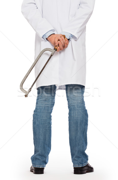 Crazy doctor is holding a big saw in his hands Stock photo © michaklootwijk