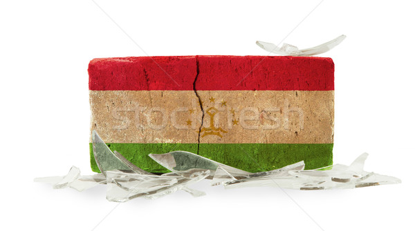 кирпичных битое стекло насилия флаг Таджикистан стены Сток-фото © michaklootwijk