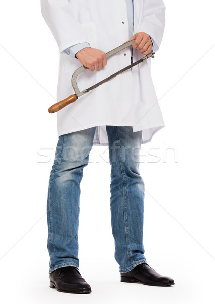 Crazy doctor is holding a big saw in his hands Stock photo © michaklootwijk