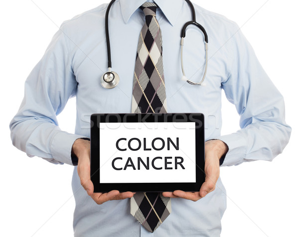 Doctor holding tablet - Colon cancer Stock photo © michaklootwijk