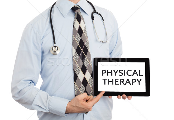 Arzt halten Tablet Physiotherapie isoliert weiß Stock foto © michaklootwijk