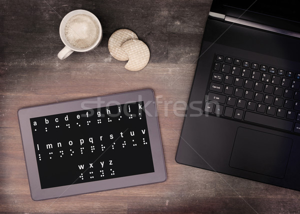 Braille on a tablet, concept of impossibility Stock photo © michaklootwijk