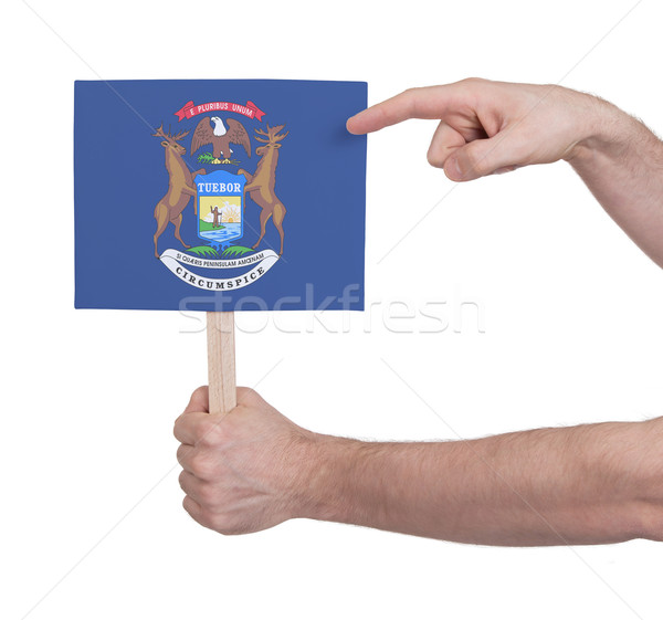 Hand holding small card - Flag of Michigan Stock photo © michaklootwijk