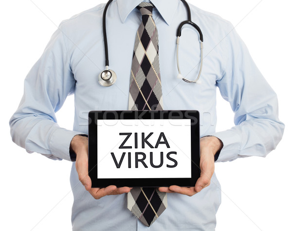 Doctor holding tablet - Zika virus Stock photo © michaklootwijk