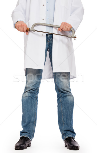 Crazy doctor is holding a big saw in his hands Stock photo © michaklootwijk