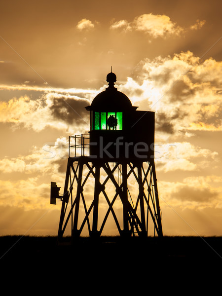 Silhouet groene baken nederlands kust zonsondergang Stockfoto © michaklootwijk