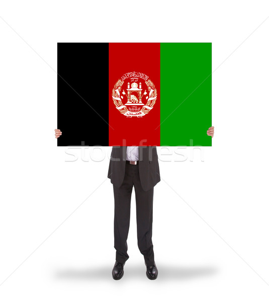 Businessman holding a big card, flag of Afghanistan Stock photo © michaklootwijk