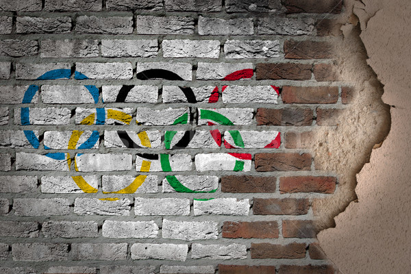 Dark brick wall with plaster - Olympic rings Stock photo © michaklootwijk