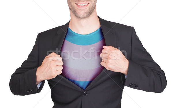 Businessman opening suit to reveal shirt with flag Stock photo © michaklootwijk