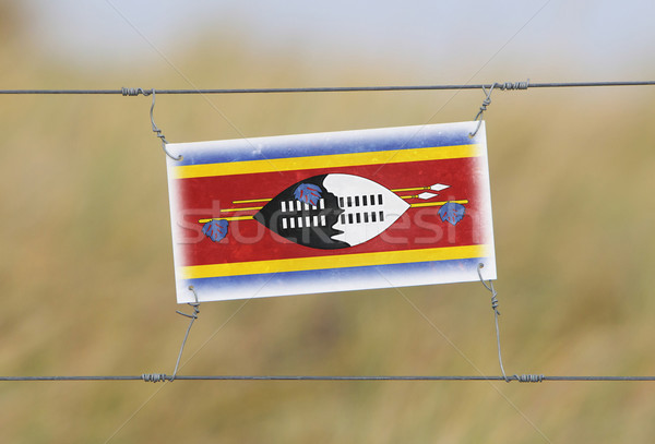 Frontera cerca edad plástico signo bandera Foto stock © michaklootwijk