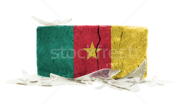 Cegły stłuczone szkło przemocy banderą Kamerun budynku Zdjęcia stock © michaklootwijk