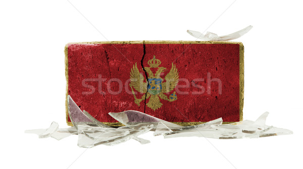 Tijolo cacos de vidro violência bandeira Montenegro parede Foto stock © michaklootwijk