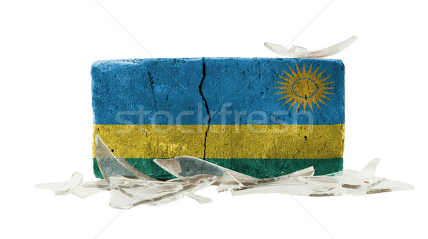 Cegły stłuczone szkło przemocy banderą Rwanda ściany Zdjęcia stock © michaklootwijk