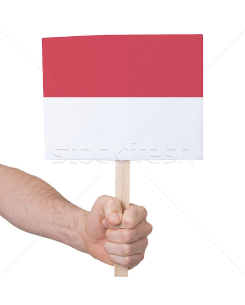 Hand holding small card - Flag of Indonesia Stock photo © michaklootwijk