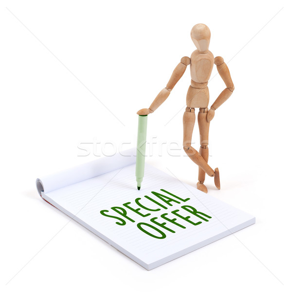 Wooden mannequin writing - Special offer Stock photo © michaklootwijk
