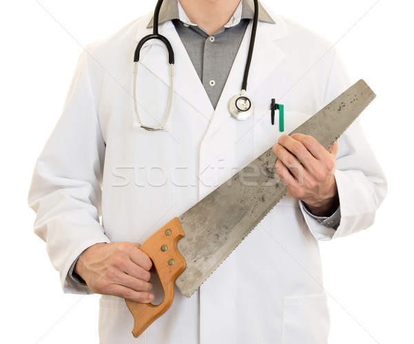 Crazy doctor is holding a big saw in his hands Stock photo © michaklootwijk