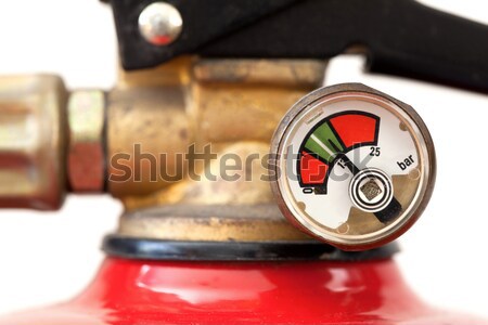 Stock photo: Dusty fire extinguisher fully charged, selective focus