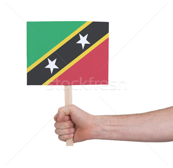 Hand holding small card - Flag of Saint Kitts and Nevis Stock photo © michaklootwijk