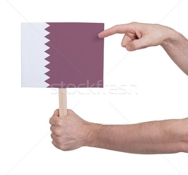 Hand holding small card - Flag of Qatar Stock photo © michaklootwijk