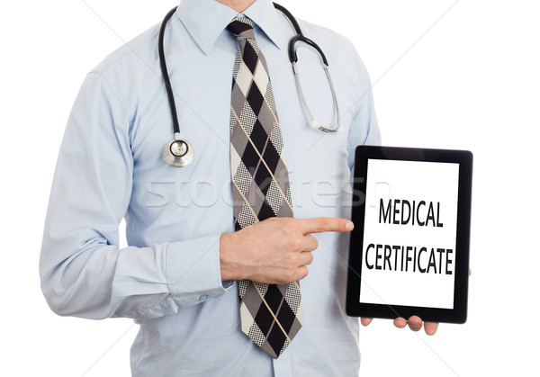 Stock photo: Doctor holding tablet - Medical certificate