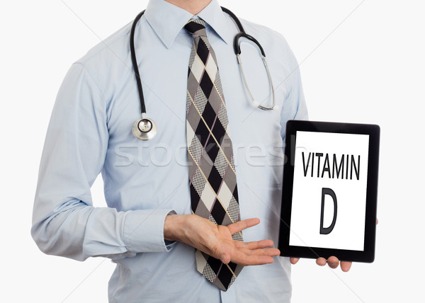 Orvos tart tabletta D-vitamin izolált fehér Stock fotó © michaklootwijk