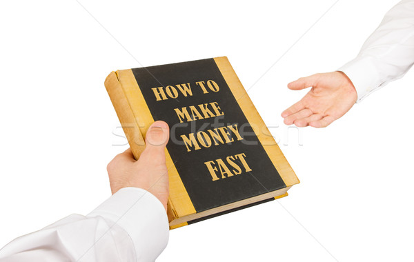 Geschäftsmann benutzt Buch ein anderer Erzeugnis Geld Stock foto © michaklootwijk