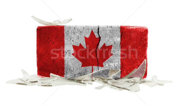 Tijolo cacos de vidro violência bandeira Canadá parede Foto stock © michaklootwijk