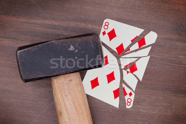 Hammer with a broken card, eight of diamonds Stock photo © michaklootwijk