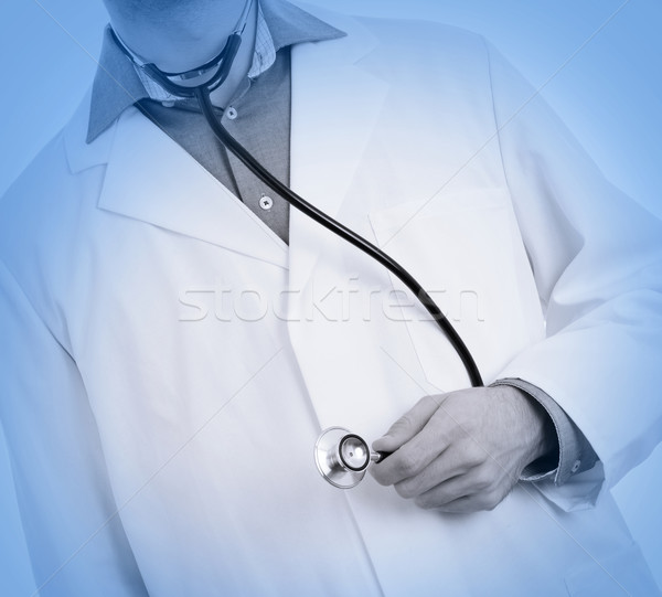 Close up of a Doctor's hand, holding a stethoscope, medical blue Stock photo © michaklootwijk